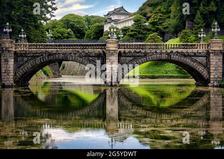 The Seimon Ishibashi bridge over the moat at the main gate of the Imperial Palace grounds, residence of Japanese Emperor Naruhito in Tokyo, Japan. Stock Photo