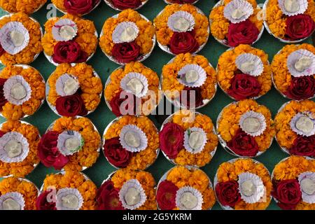 2 February 2021, Holy Colors of orange and red flowers in Varanasi Ghat, India. Stock Photo
