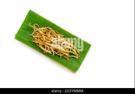 Top view fresh sliced finger roots in nature tray of banana leaf and banana tree, image freshly sliced finger roots in nature tray on white background Stock Photo