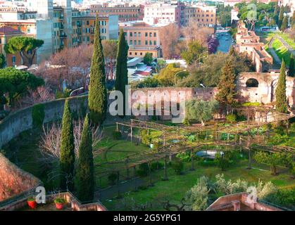 View from a roof. Beneath is the garden of the Basilica di Santa Croce in Gerusalemme. The walls around the garden are from the amphitheatre Castrense Stock Photo