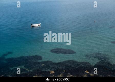 A Boat And A Buoy Off The Island Of Milos In The Aegean Sea, Greece Stock Photo