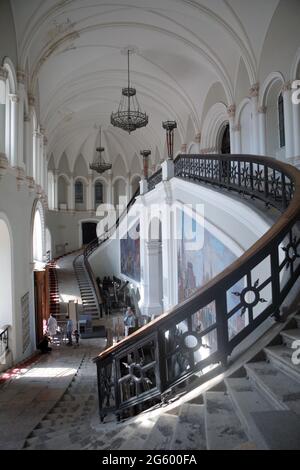 St. Petersburg, Russia, 29th July, 2018: People at the main staircase of the Artillery Museum. The building, initially named New Arsenal on Kronwerk, was erected in 1848-1860 by design of the architect Peter Tamansky Stock Photo