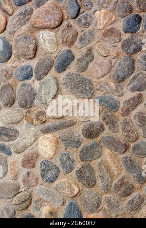 Texture background from granite paving stones. Cemented stones. Vertical image. Stock Photo