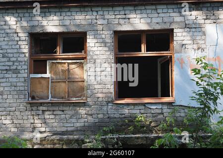 Ruined houses and old dilapidated buildings, houses with broken windows. Stock Photo