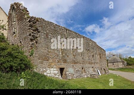 Penmon Priory, with Dovecote in background Stock Photo