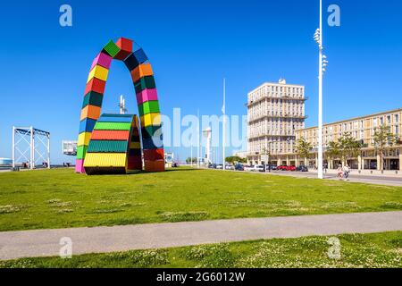 The 'Catène de containers' sculpture, the control tower of the harbor master's office and the UNESCO classified buildings in Le Havre, France. Stock Photo