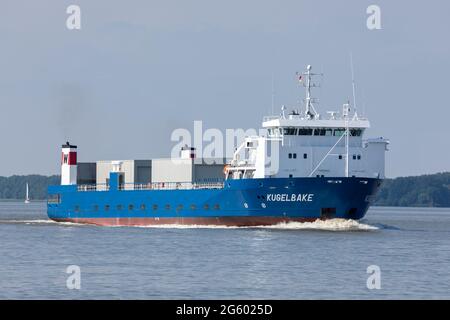Stade, Germany – June 25, 2021: Ro-Ro cargo ship MV KUGELBAKE on Elbe river transporting oversized containers for Airbus Industries. Stock Photo