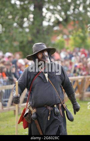St. Petersburg, Russia - July 8, 2017: Participant in the costume of plague doctor during the military history project Battle On Neva Stock Photo