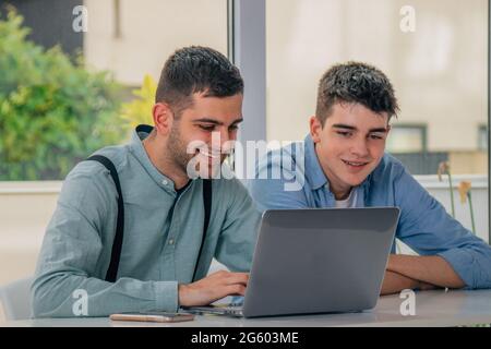 young people with laptops on the desks Stock Photo