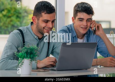 young people with laptops on the desks Stock Photo