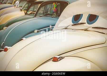 Retro styled image of a row of classic cars Stock Photo