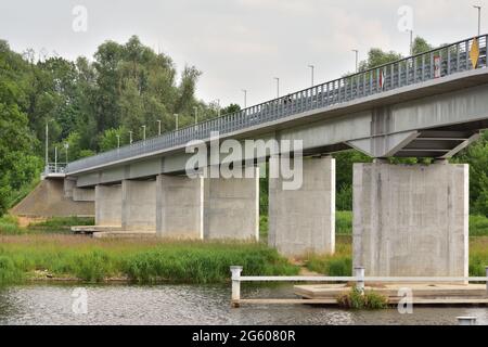 Bridge over the river on a cloudy day. Summer. Stock Photo