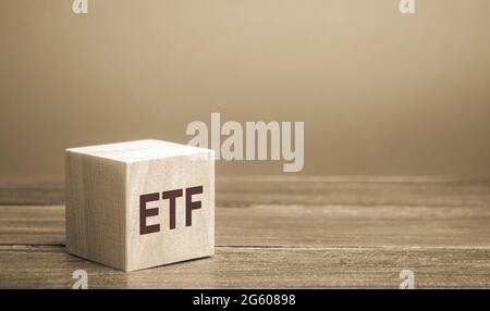 Wooden blocks ETF - Exchange Traded Fund. Type of investment fund and exchange-traded product. Stock exchanges. Business and finance concept Stock Photo