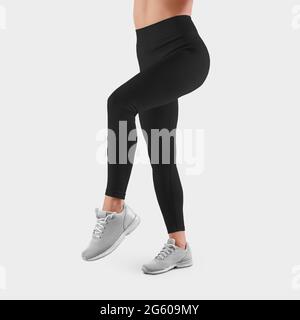 Mockup of black leggings on a girl standing with her back on toes, in the  background in the studio, posing. Tight-fitting pants template for design  pr Stock Photo - Alamy