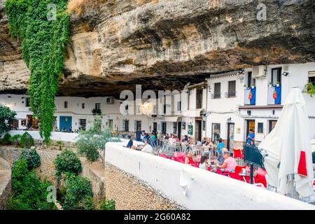 White washed houses built under the rock in Setenil de las Bodegas, Andalucia, Spain Stock Photo