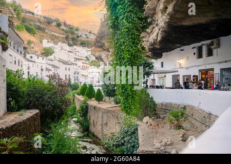 White washed houses built under the rock in Setenil de las Bodegas, Andalucia, Spain Stock Photo