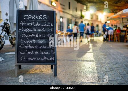 Menu of the meats of restaurant in the sidewalk of Setenil de las Bodegas, Andalucia, Spain Stock Photo
