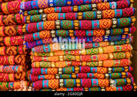 Folded colorful middle eastern carpets at bazaar Stock Photo