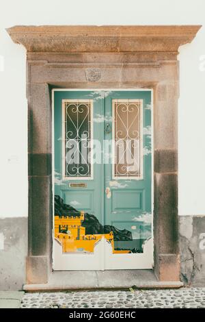 Painted door of house, Rua de Santa Maria, Funchal old town, Madeira island, Portugal Stock Photo