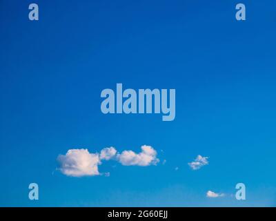 Beautiful small fluffy clouds in the blue sky Stock Photo