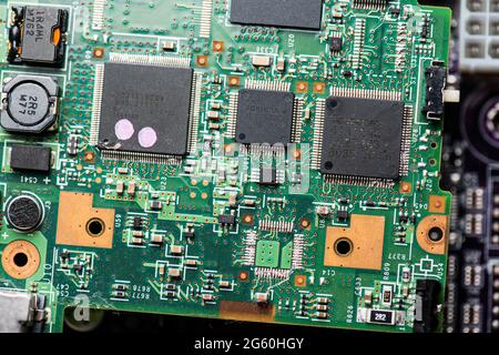 Close up image of circuit boards taken from old PC desk top computers. The image shows electronic components soldered onto coloured cuircuit boards. Stock Photo