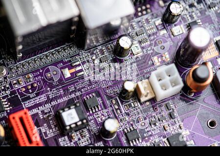 Close up image of circuit boards taken from old PC desk top computers. The image shows electronic components soldered onto coloured cuircuit boards. Stock Photo