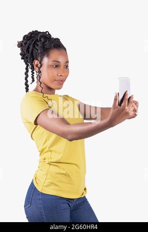 Afro american woman using both hands to take a photo of herself Stock Photo