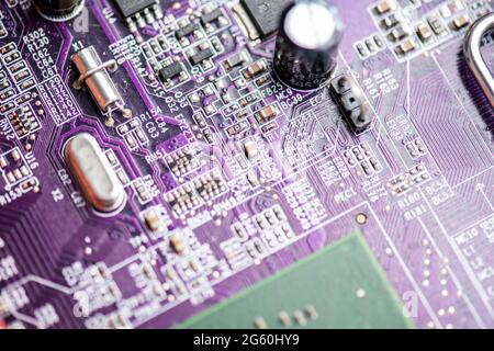 Close up image of circuit boards taken from old PC desk top computers. The image shows electronic components soldered onto coloured cuircuit boards. Stock Photo