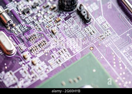 Close up image of circuit boards taken from old PC desk top computers. The image shows electronic components soldered onto coloured cuircuit boards. Stock Photo
