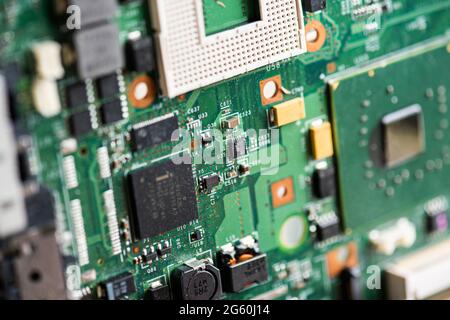 Close up image of circuit boards taken from old PC desk top computers. The image shows electronic components soldered onto coloured cuircuit boards. Stock Photo