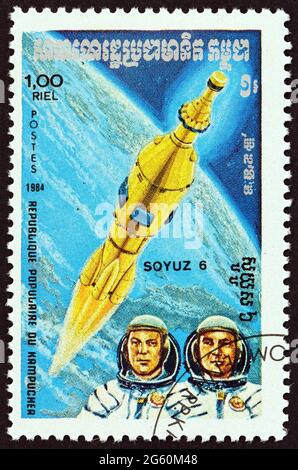 KAMPUCHEA - CIRCA 1984: A stamp printed in Kampuchea from the 'Space Research' issue shows Soyuz 6 and cosmonauts, circa 1984. Stock Photo