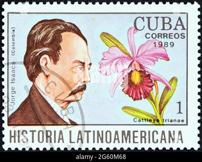 CUBA - CIRCA 1989: A stamp printed in Cuba from the 'Latin American History' issue shows Jorge Isaacs and Cattleya trianae (Colombia). Stock Photo