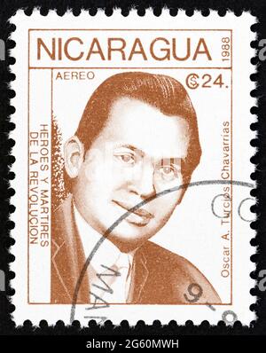 NICARAGUA - CIRCA 1988: A stamp printed in Nicaragua from the 'Revolutionaries' issue shows Oscar A. Turcios Chavarrias, circa 1988. Stock Photo