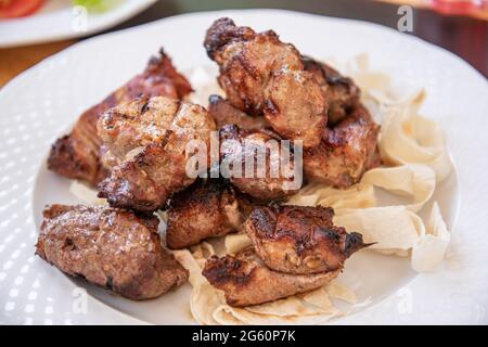 Pork kebab on a plate. Stock Photo