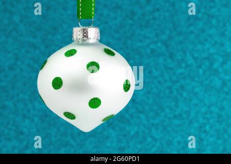 A Delicate Glittery Christmas Ornament Hanging on a Ribbon Stock Photo