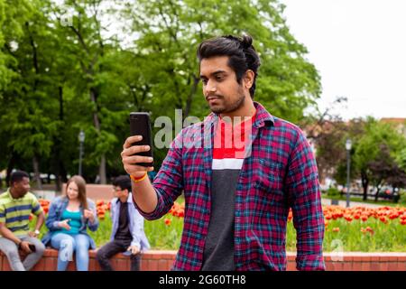 Student having online call with his family Stock Photo