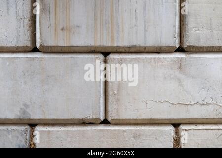 Grey concrete blocks wall natural texture background Stock Photo
