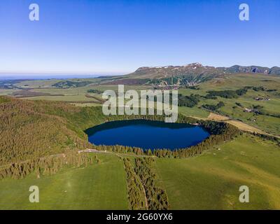 France, Puy de Dome, Besse et Saint Anastaise, Parc Naturel Regional des Volcans d'Auvergne (Natural regional park of Volcans d'Auvergne), Cezallier, the Lac Pavin, volcanic maar lake, the Monts Dore in the background, Sancy (aerial view) Stock Photo