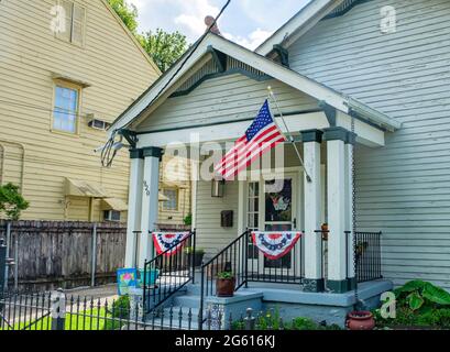 NEW ORLEANS, LA, USA - JUNE 28, 2021: Patriotic decorations on front porch of Uptown home Stock Photo
