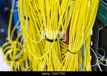 The yellow network cables in the server room for connecting to a network internet Stock Photo