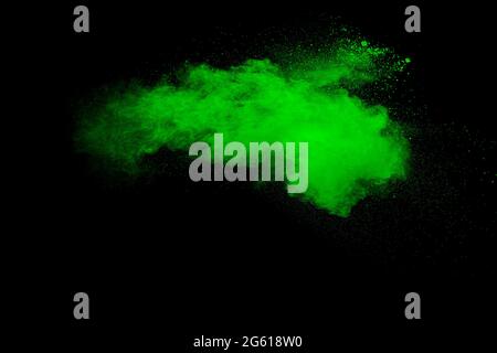 Green powder explosion on black background. Stock Photo