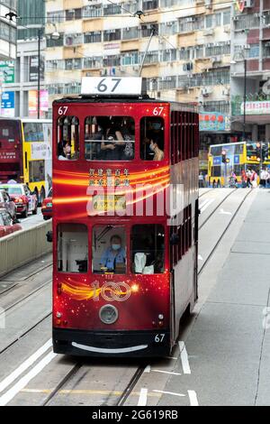 Hong Kong, China. 01st July, 2021. HONG KONG, HONG KONG SAR, CHINA: JULY 1st 2021. An iconic Hong Kong tram is decorated in celebration of the 100th Anniversary of the Communist party in China. Alamy Live news/Jayne Russell Credit: Jayne Russell/Alamy Live News Stock Photo