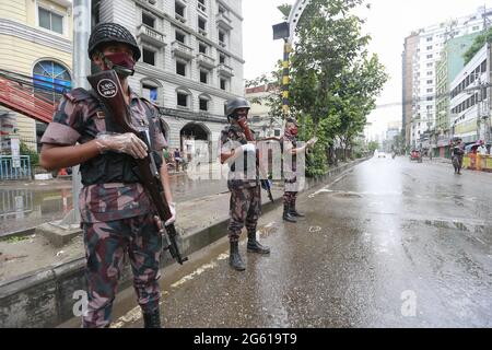 Border Guard Bangladesh (BGB) personnel limit people's movement from a check post set up at Banglamotor intersection, the first day of a nationwide'strict lockdown' to curb the coronavirus pandemic, in Dhaka, Bangladesh, July 1, 2021. Photo by Kanti Das Suvra/ABACAPRESS.COM Stock Photo