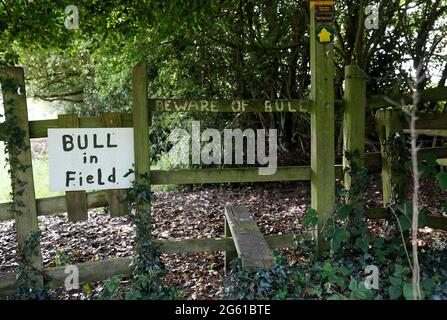 Swannington, Leicestershire, UK. 1st July 2021. A sign warns of a bull in the field on a public footpath. Swannington is a former mining village situa Stock Photo