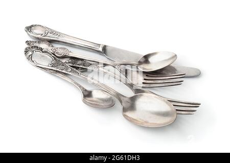 Group of old silver cutlery isolated on white Stock Photo