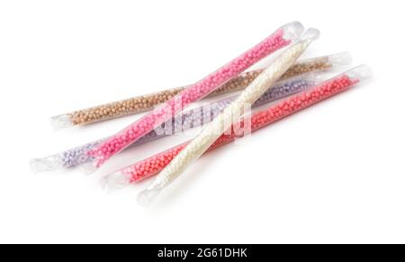 Group of various milk flavoring straws isolated on white Stock Photo