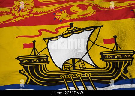 Full frame close-up on a waving flag of New Brunswick (Canada) in 3D rendering. Stock Photo