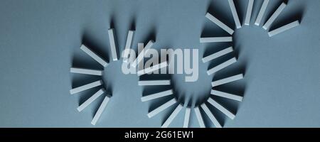 Light Blue wood domino pieces on light blue background. Leisure games concept. Stock Photo