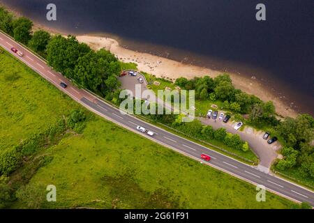 Loch Lubnaig, Loch Lomonnd and Trossachs National Park, Scotland, UK. 1st July, 2021. PICTURED: Drone aerial view looking down from above of Loch Lubnaig showing the low water levels which have exposed stone beaches all along the perimeter of the loch side, which would otherwise be under dark peaty water. Credit: Colin Fisher/Alamy Live News Stock Photo