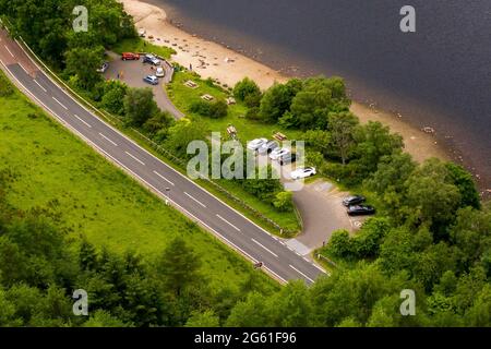 Loch Lubnaig, Loch Lomonnd and Trossachs National Park, Scotland, UK. 1st July, 2021. PICTURED: Drone aerial view looking down from above of Loch Lubnaig showing the low water levels which have exposed stone beaches all along the perimeter of the loch side, which would otherwise be under dark peaty water. Credit: Colin Fisher/Alamy Live News Stock Photo